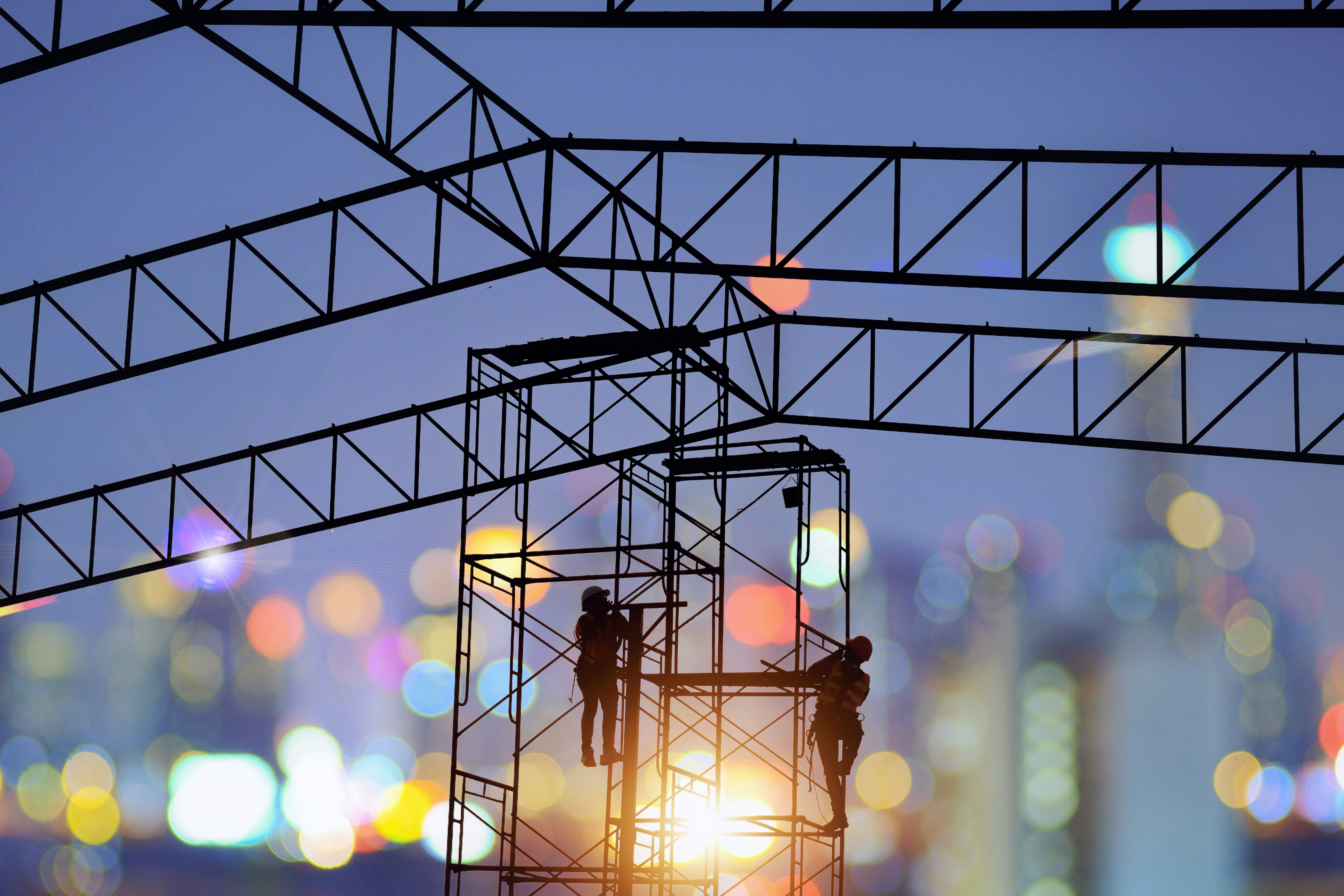 Steel warehouse frame at sunset