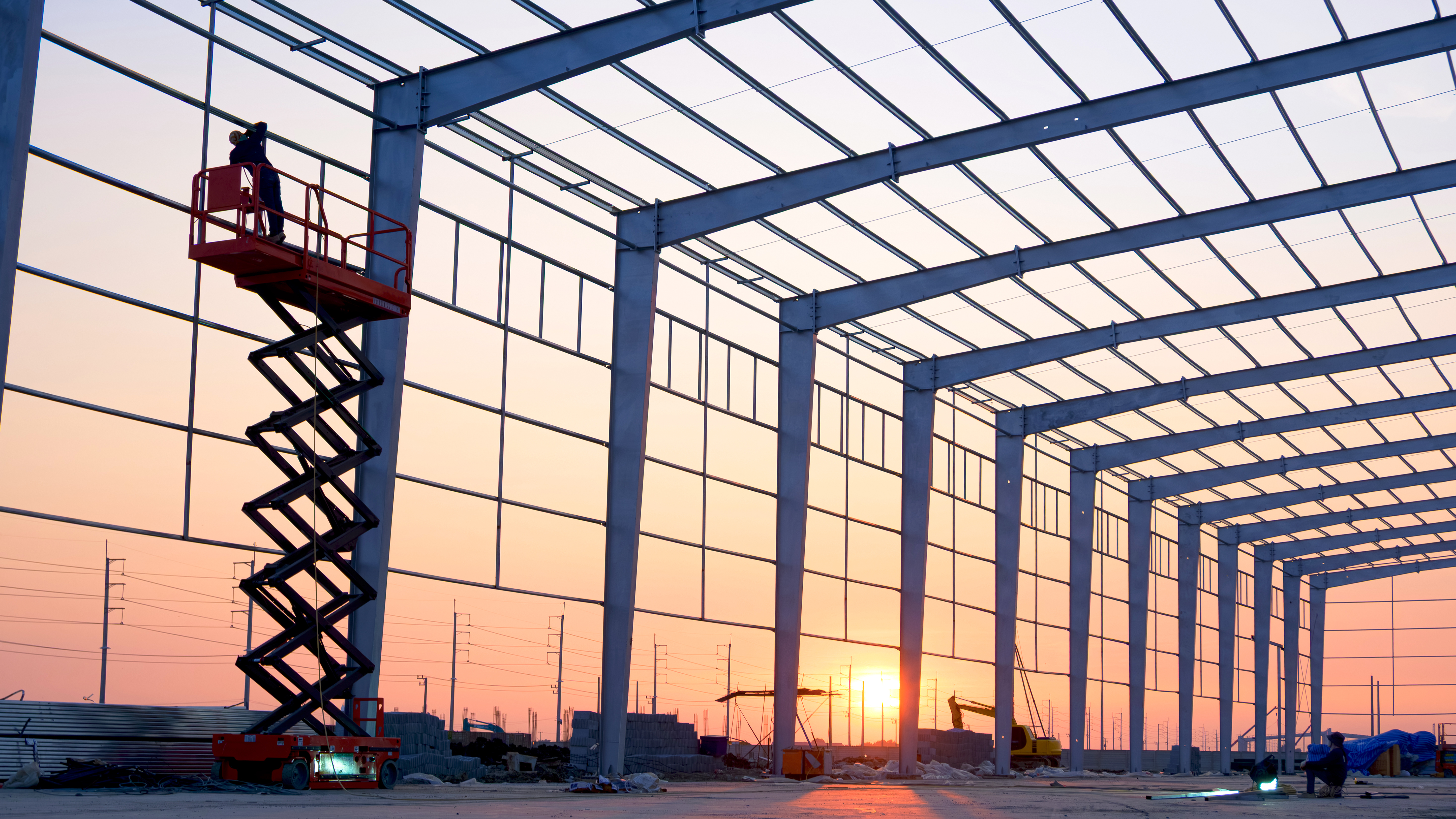 Structural steelworks documented at dusk